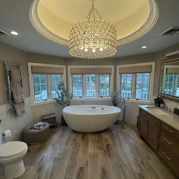 Bathroom with a freestanding bathtub and vanities
