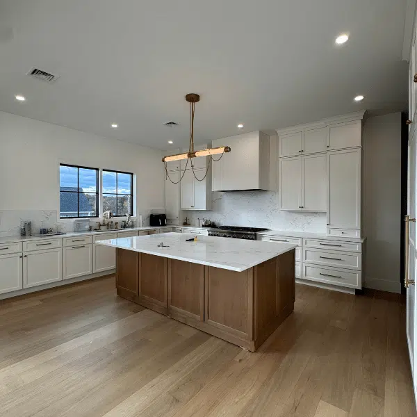 Kitchen with an island and white cabinets