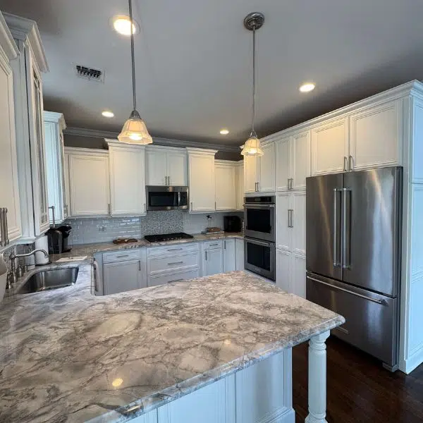 Kitchen with a marble counter and cabinets