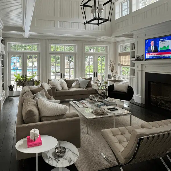 Living room with seating and tall windows